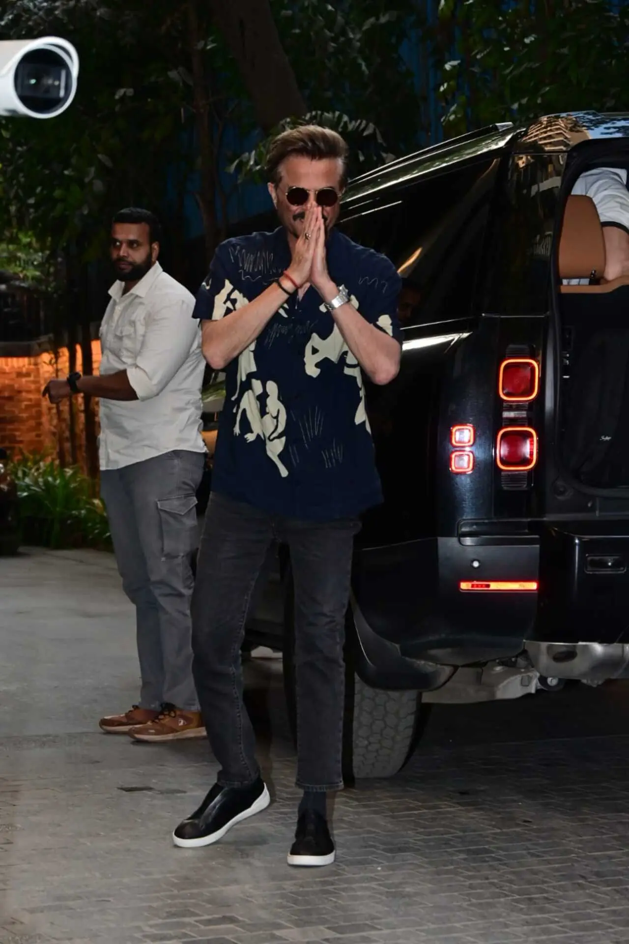 Anil Kapoor arrived at the screening of Subedaar in blue shirt and black denims. He greeted the paps with folded hands and fun smile.